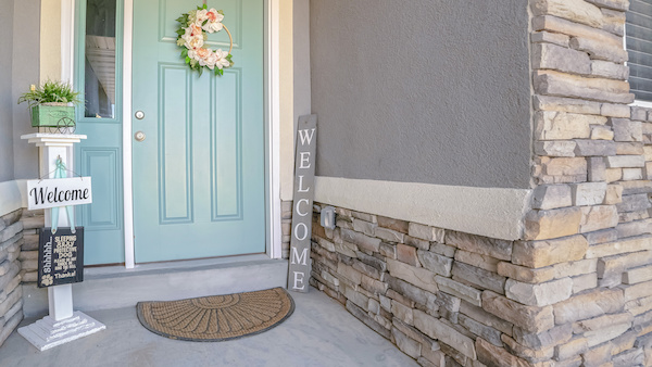 Panorama frame Green painted front door to a suburban house