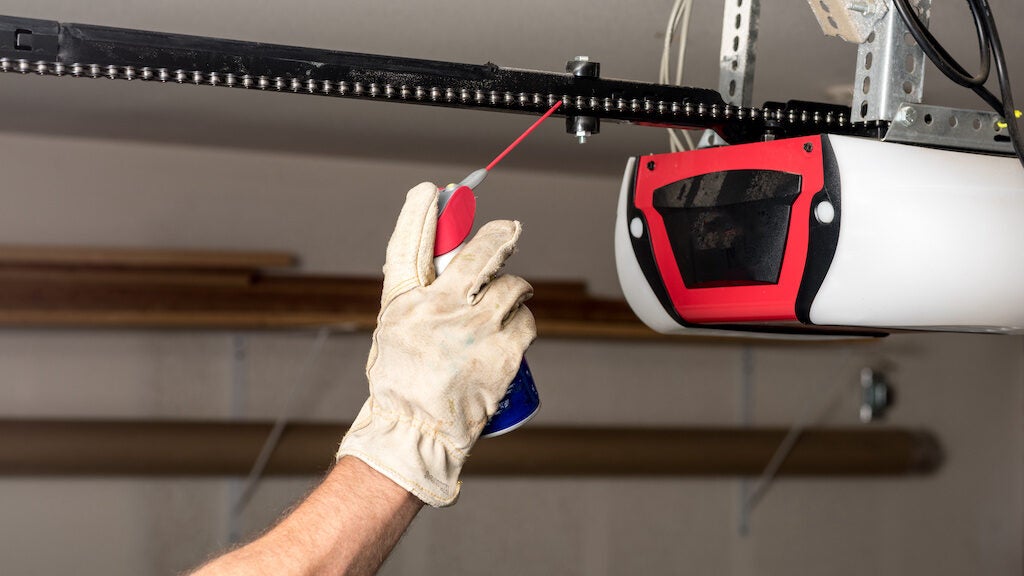 Applying oil to a chain of a garage door opener