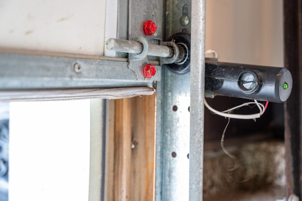 One receptor eye of a garage door safety sensor that stops action if the beam is crossed